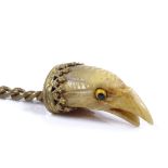 A Victorian carved horn and gilt-metal eagle head fob