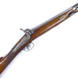 A 19th century percussion rifle with engraved lock