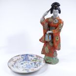 A Japanese porcelain standing figure with painted and gilded robes, height 60cm, and a Japanese