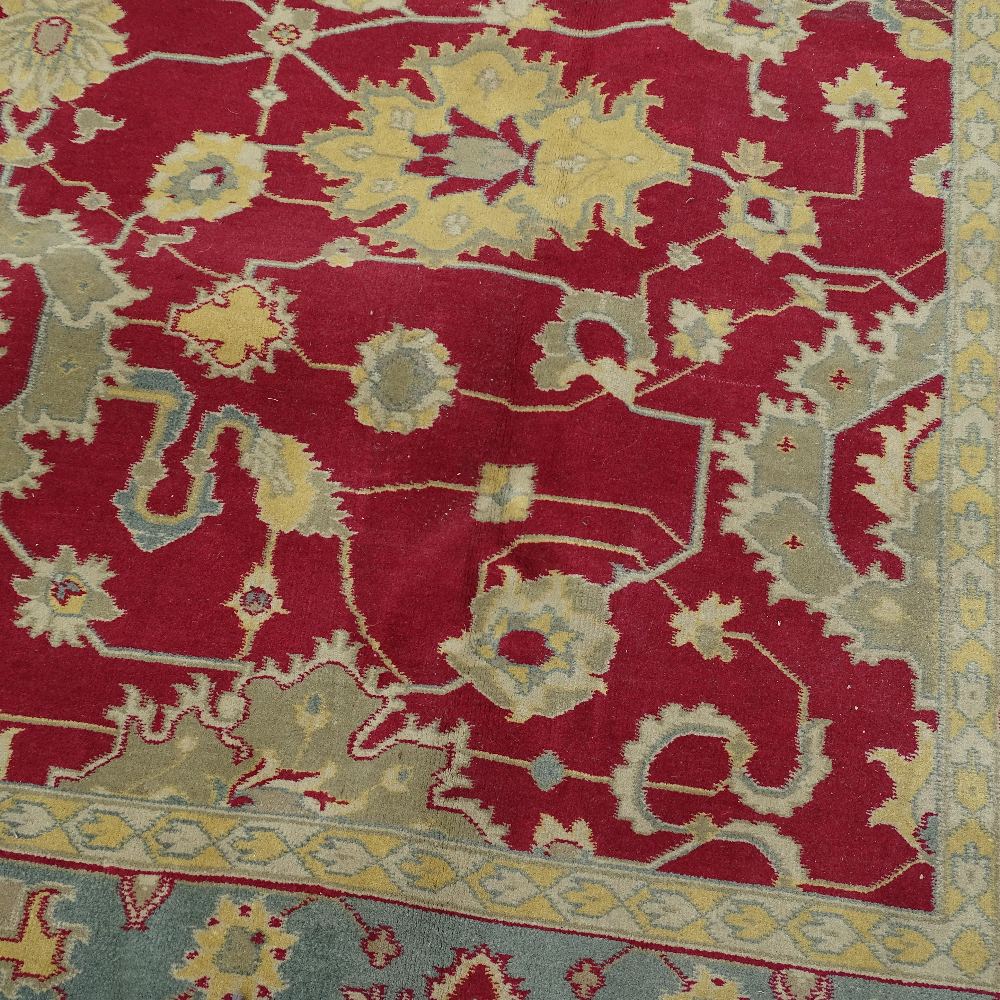 A large red ground handwoven Oshak rug, circa 1950, 370cm x 274cm - Image 2 of 4