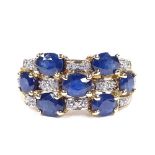 A 9ct gold sapphire and diamond dress ring, setting height 11mm, size N, 4.9g
