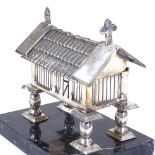 A Continental silver jewel box, modelled as a church on stilts, with red felt interior, standing