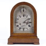 An oak-cased dome-top mantel clock, with engraved silvered dial, 8-day chiming movement, height 36cm
