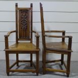 A pair of Gothic style oak hall elbow chairs with relief carved tracery back panels