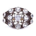 An unmarked gold white sapphire cluster dress ring, with pierced openwork settings, setting height