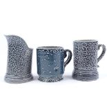 Walter Keeler (British born 1942), a blue salt glaze leaning jug, height 12cm, and 2 salt glaze
