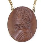 A relief carved lava cameo pendant necklace, depicting Tudor portrait, possibly Sir Francis