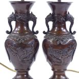A pair of Chinese patinated bronze table lamps, height including fittings 39cm