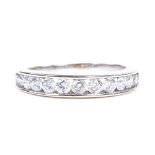 An 18ct white gold diamond half-eternity ring, each diamond approx 0.1ct, total channel set