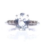 A 9ct white gold aquamarine and diamond dress ring, oval-cut aqua approx 2.25ct, size N, 2.6g