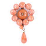 A carved and polished coral bead pendant, gilt-metal settings, pendant height 41.1mm, 4.6g