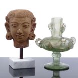 An Indian Gupta terracotta head on stand, height 14cm, and an Islamic iridescent glass vessel (2)