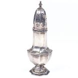 An Edwardian octagonal silver sugar shaker, by Mappin & Webb, hallmarks London 1908, height 18.