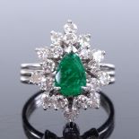 An 18ct white gold emerald and diamond cluster cocktail ring, pear-cut emerald approx 1ct, setting