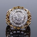 A French 18ct gold diamond cluster cocktail ring, with openwork settings and bridge, central stone