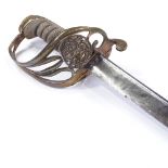 A Krupps pipe-back sword, etched armorial designs on the blade, brass hilt with lion and crown