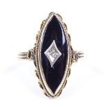 An unmarked gold onyx and diamond marquise panel ring, with rope twist bezel, setting height 24.1mm,