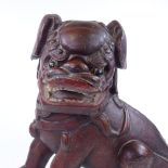 A large Chinese carved and gilded wood Dog of Fo, height 53cm