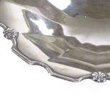 A large circular silver table centre fruit bowl, with scalloped shell rim, by Adie Brothers Ltd,