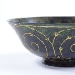 An Islamic jade bowl with gilded engraved decoration, diameter 12.5cm