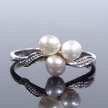 A 9ct white gold pearl trio dress ring, setting height 8.8mm, size O, 1.5g