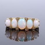 An 18ct gold 5-stone graduated opal and diamond half-hoop ring, with carved scrollwork bridge,