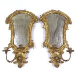 A pair of Italian carved giltwood-framed girandole wall mirrors, with candle brackets, height 22"