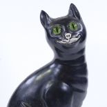 A Galle style black glaze pottery cat with green glass eyes, height 33cm