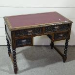 An oak knee-hole writing desk, with carved lion mask handles and bobbin turned supports, 3'1" x 22"