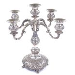 A German silver 4-branch candelabra, with relief embossed floral decoration and removable
