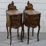 A pair of 19th century French walnut bedside cupboards, with shaped marble tops and slender cabriole