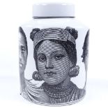 A ceramic storage jar in the style of Fornasetti, height 30cm
