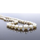 A graduated single strand matinee pearl necklace, with unmarked yellow metal abalone set clasp,