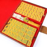 A Chinese Bakelite Mahjong set in leather case