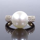 A 14ct gold Akoya pearl solitaire ring, with diamond set shoulders, total diamond content approx 0.