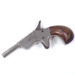 A small Antique Pinfire pocket pistol, length 12cm