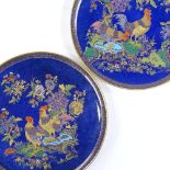 A pair of Carlton Ware Cock and Peony pattern blue ground plates with gilded decoration, diameter