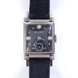BULOVA - a 14ct white gold mechanical wristwatch, square black dial with diamond set quarterly