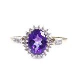 A 9ct gold amethyst and diamond cluster ring, with diamond set shoulders, hallmarks Sheffield