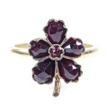 An unmarked gold faceted garnet leaf ring, setting height 16.2mm, size O, 3g