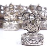 10 Burmese silver menu/name place holders, with figural tops and relief embossed bases, stamped 900,