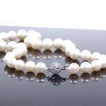 A graduated single strand Princess pearl necklace, with 14ct white gold diamond set clasp, largest