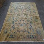 A large pale ground handwoven Turkish Oshak rug, 200cm x 300cm