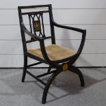 An Edwardian marquetry inlaid elbow chair on X-shaped base