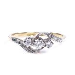 An 18ct gold 3-stone diamond crossover ring, setting height 6.1mm, size N, 2.6g