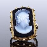 An unmarked gold relief carved hardstone cameo panel ring, depicting Centurion bust, within a bead