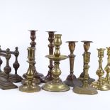 4 pairs of brass candlesticks, 2 single candlesticks, and a pair of fire dogs