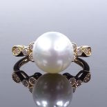 A 14ct gold South Sea pearl dress ring, with diamond set shoulders, total diamond content approx 0.