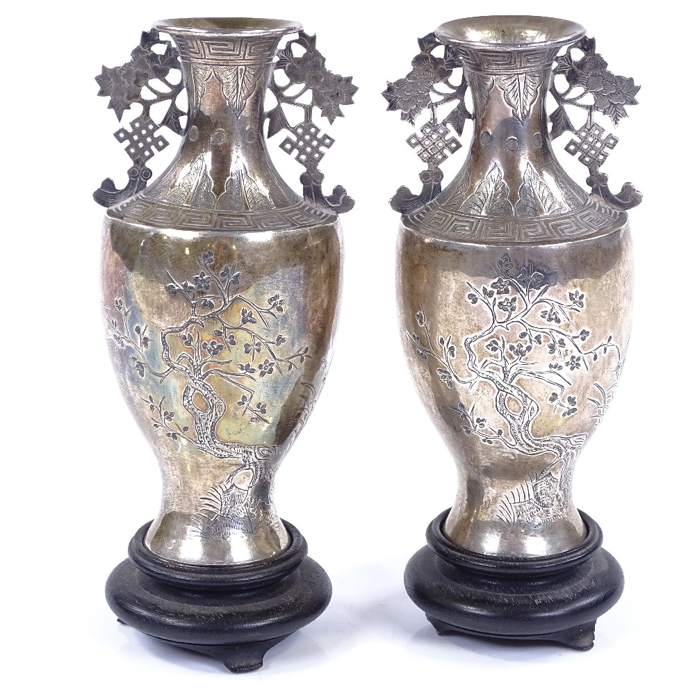 A pair of miniature Chinese silver vases, with bright-cut tree decoration and Greek key borders,