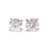 A pair of 14ct gold 1.99ct solitaire diamond earrings, with stud fittings, total diamond content